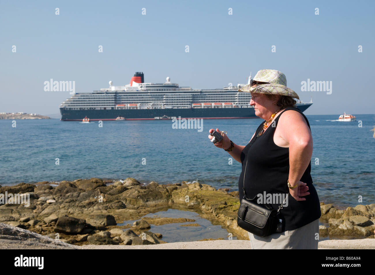 American cruise ship tourist taking photos on Mykonos, Greece Stock Photo