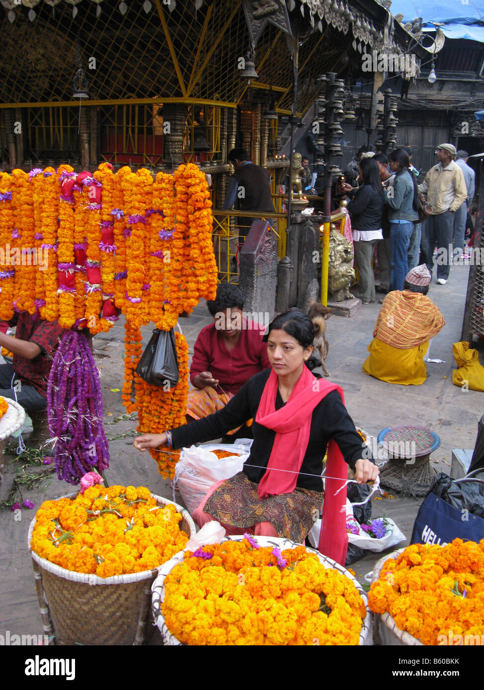 Flower seller at the early morning market in the Asan Tol area of Kathmandu, Nepal Stock Photo