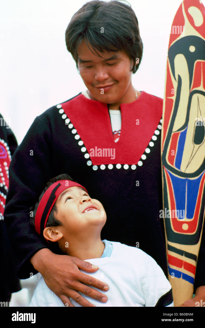 Native American Heiltsuk Indian Father and Son in Traditional Ceremonial Regalia Stock Photo