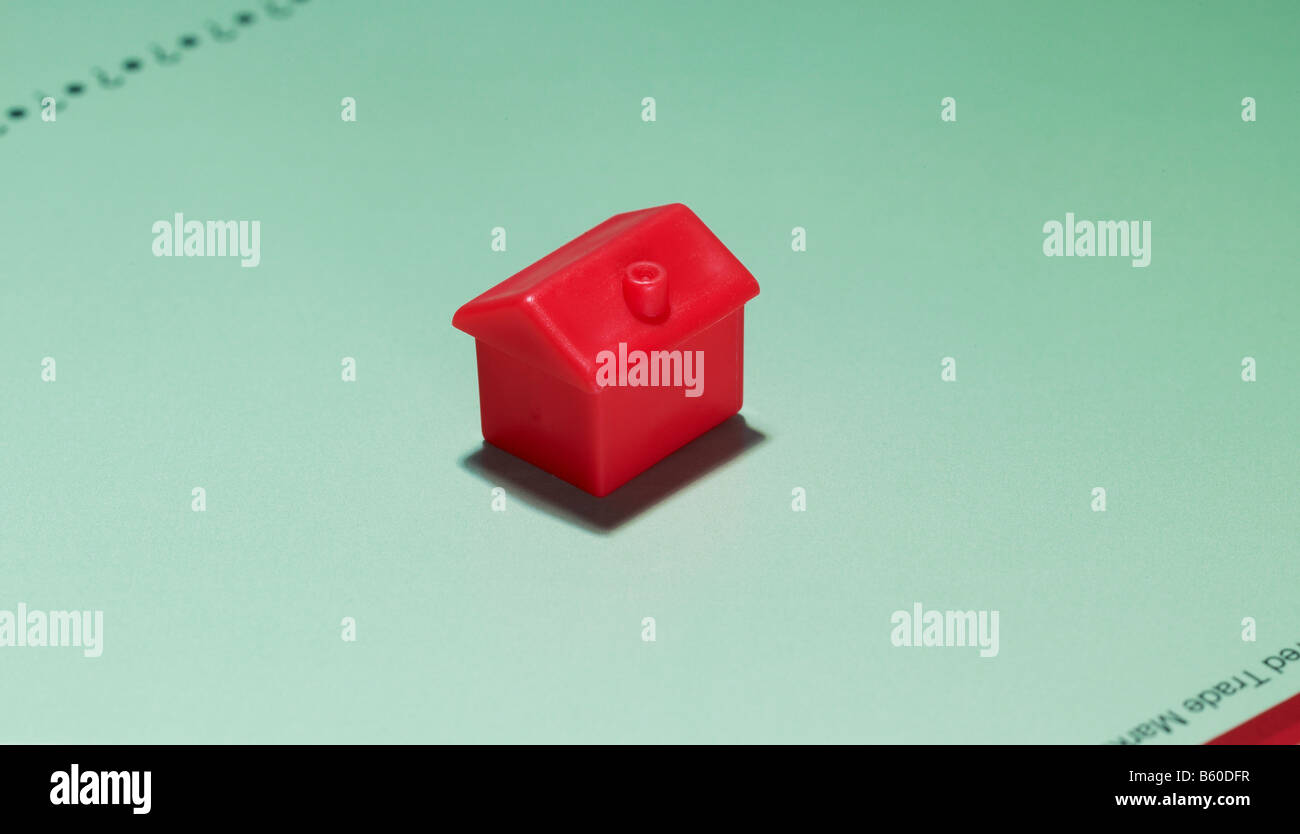 red monopoly hotel sitting on a game board Stock Photo Alamy