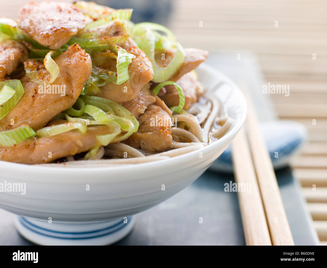 Bowl of Chicken and LeekSoba Noodles in Broth Stock Photo