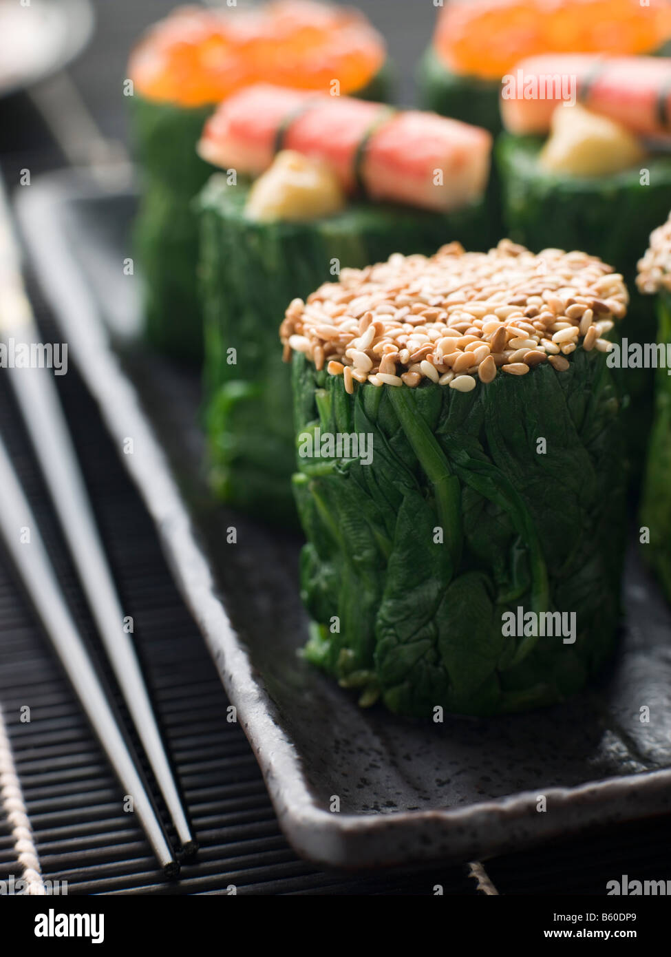 Rolled Spinach Three Ways-Snow Crab Toasted Sesame Seeds and salmon Roe Stock Photo
