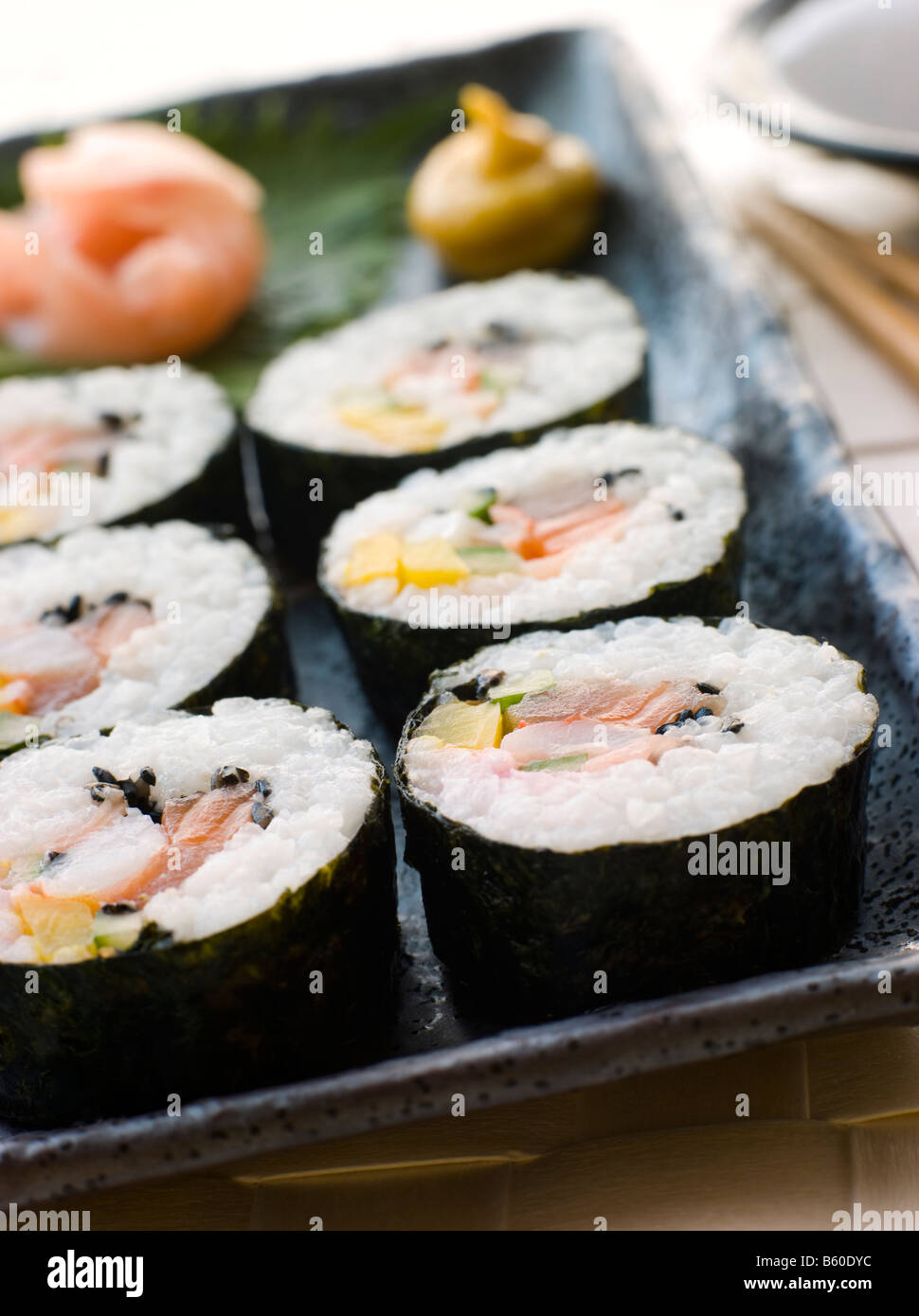 Large Spiral Rolled Sushi with Sushi Ginger Wasabi and Soy Sauce Stock
