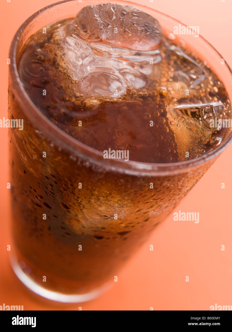 Glass of Cola with Ice Cubes Stock Photo
