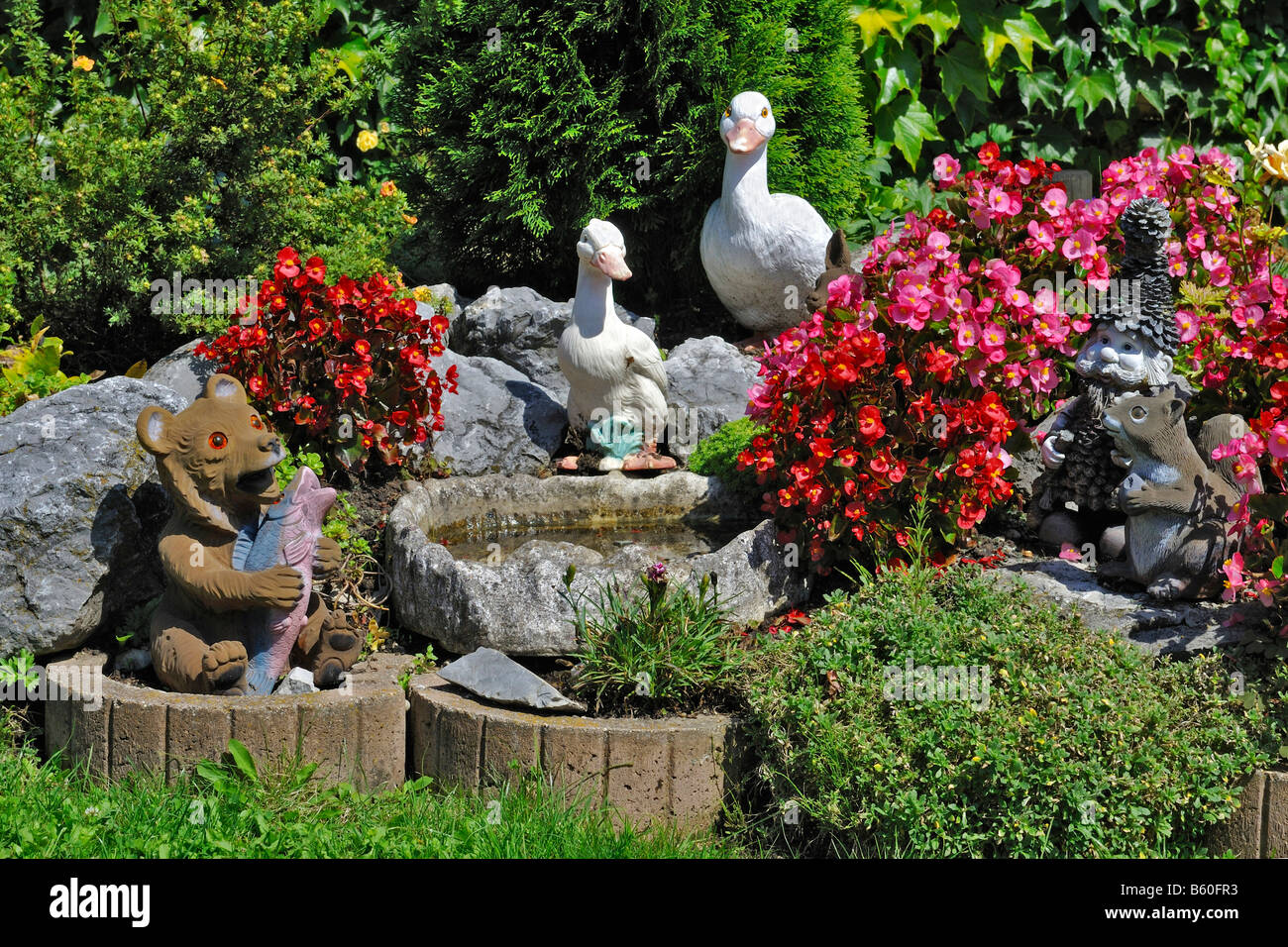 garden gnomes and figurines of ducks squirrels and a bear in a bavarian garden near - Garden Figurines garden gnomes and figurines of ducks squirrels and a bear in a bavarian garden near - Garden Figurines