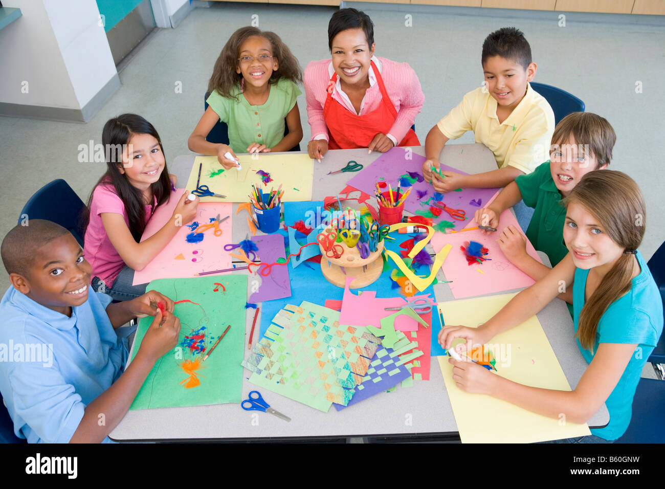 Teacher and students in art class Stock Photo