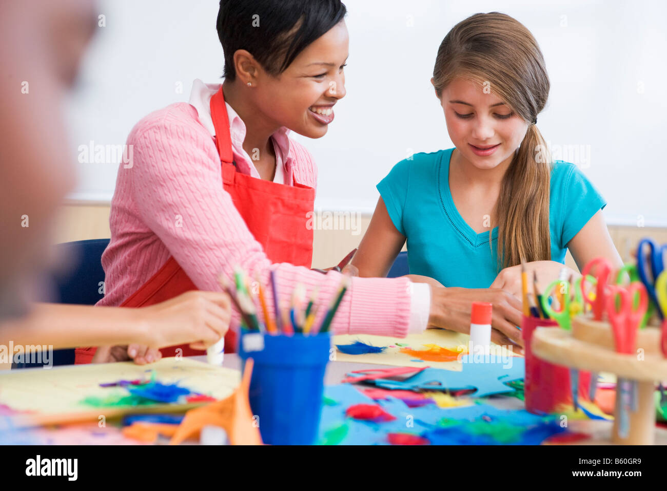 Teacher and student in art class (selective focus Stock Photo - Alamy