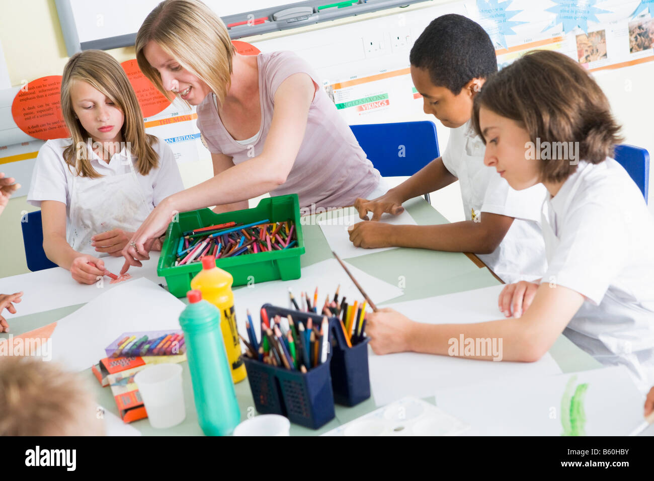 Students in art class with teacher Stock Photo