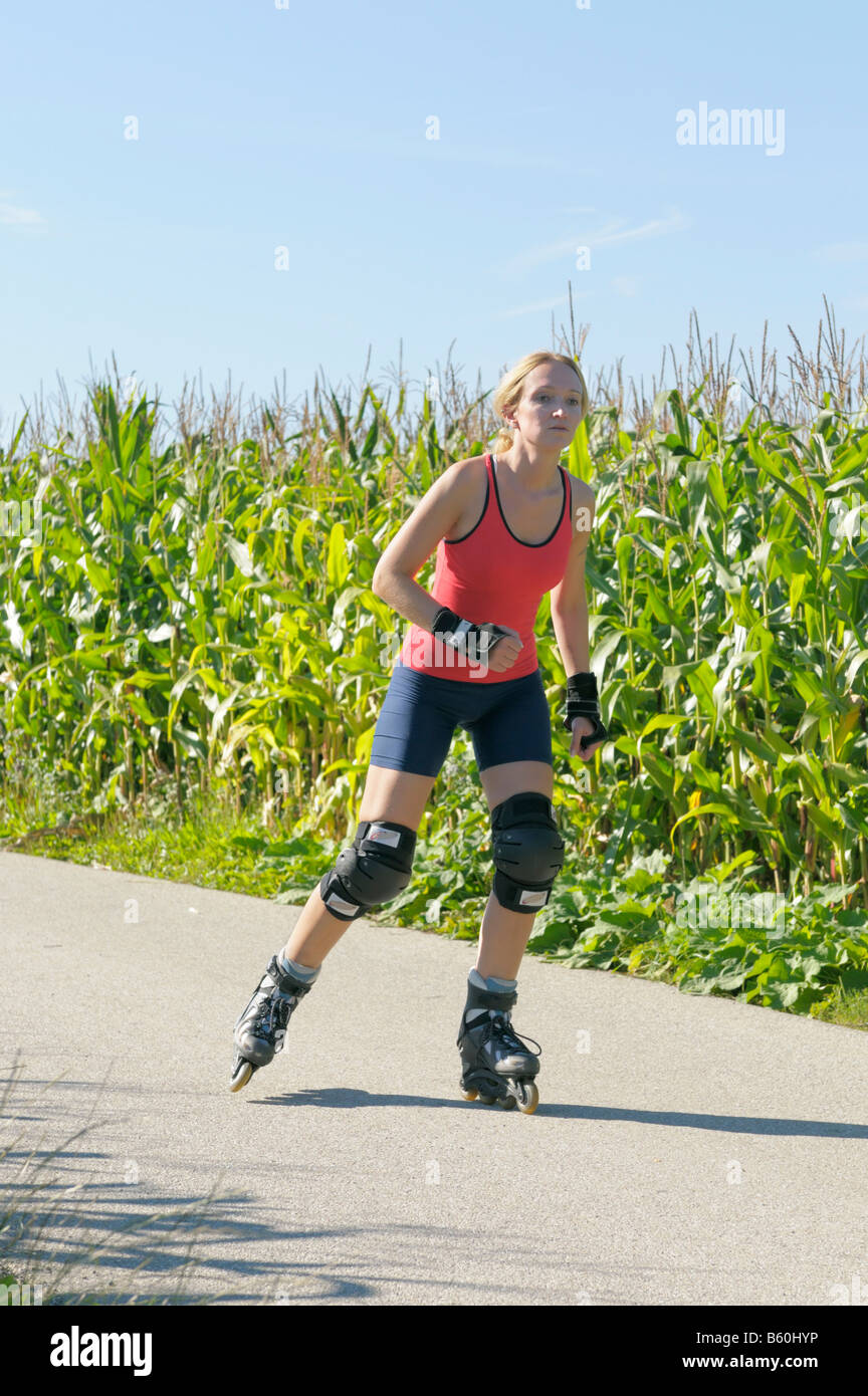 Young woman roller blading Stock Photo Alamy