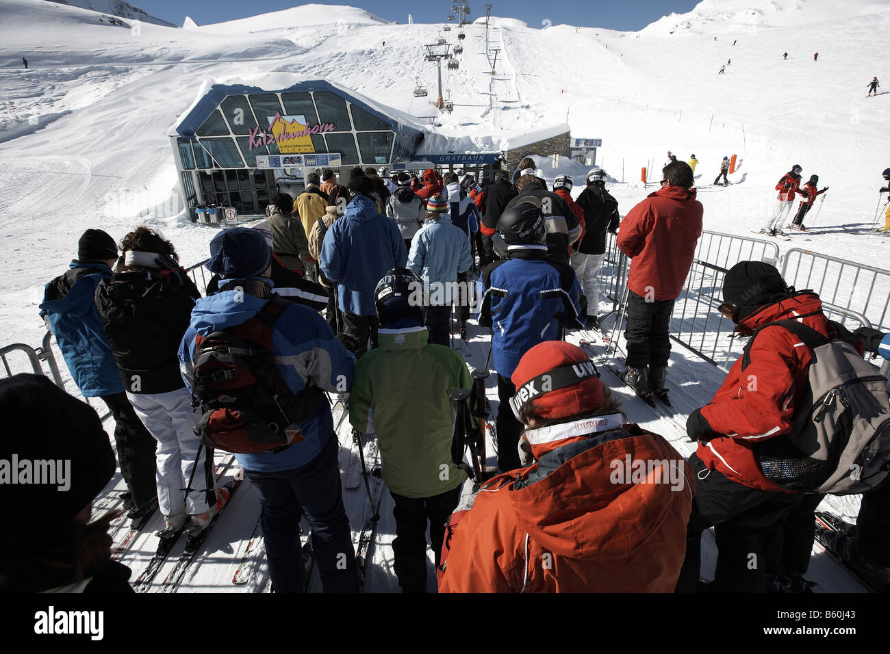 Skiers queuing for ski lift Queuing for the Gratbahn ski lift to Kitzsteinhorn Kaprun Austria Europe Stock Photo