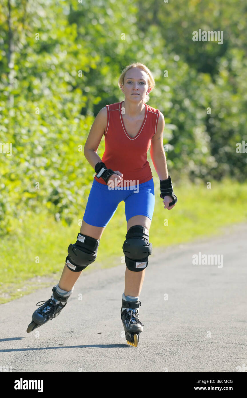 Young woman roller blading Stock Photo Alamy