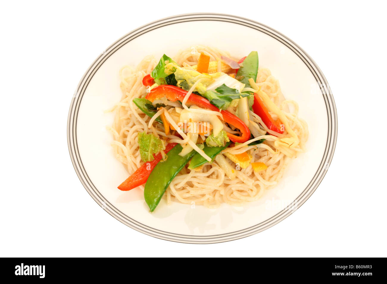 Fresh Healthy Asian Style Vegetarian Meal Of Noodles And Stir Fried Vegetables Isolated Against A White Background With No People And A Clipping Path Stock Photo