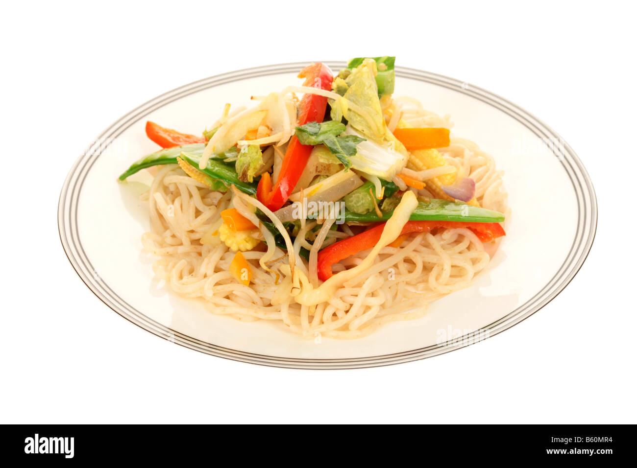 Fresh Healthy Asian Style Vegetarian Meal Of Noodles And Stir Fried Vegetables Isolated Against A White Background With No People And A Clipping Path Stock Photo
