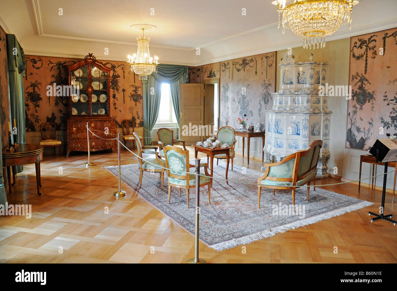Salon, interior arrangement with tiled stove and furniture, Lenzburg Castle, historical museum, Aargau, Switzerland, Europe Stock Photo