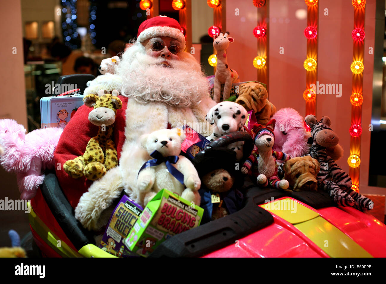 Funky Father Christmas with toys in Selfridges window Stock Photo Alamy