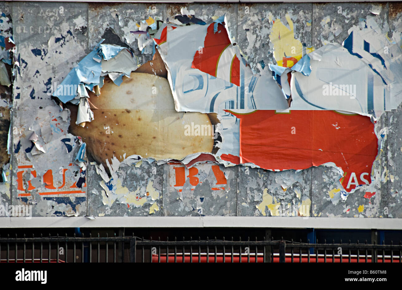 a torn advertising sign ripped in stoke on trent uk Stock Photo - Alamy
