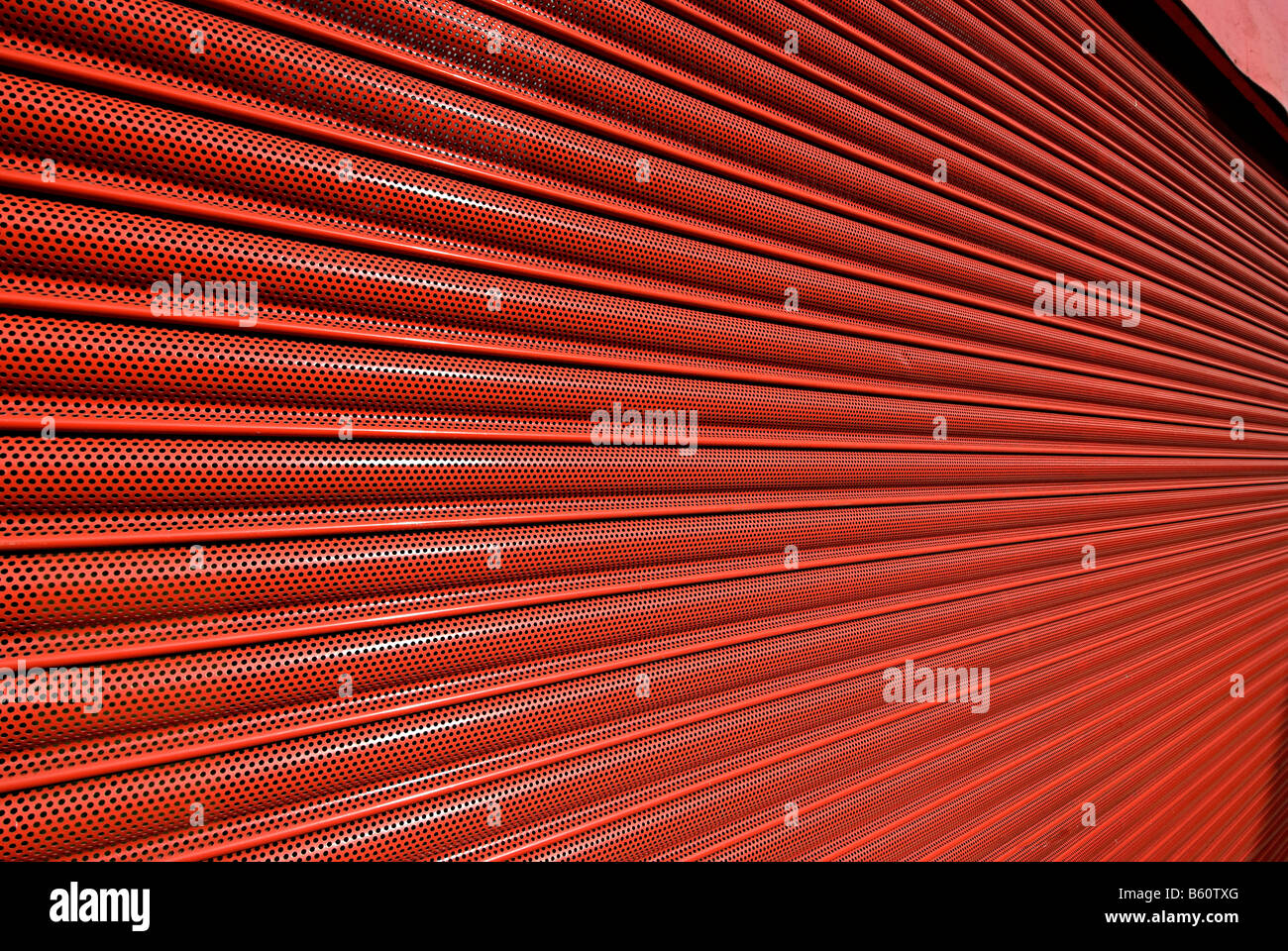red metal shutter security door on a shop front Stock Photo