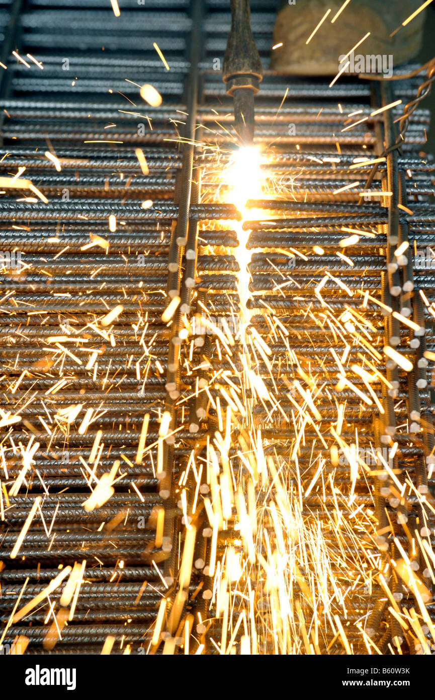 Cutting steel reinforcing mesh with a cutting torch Stock Photo Alamy