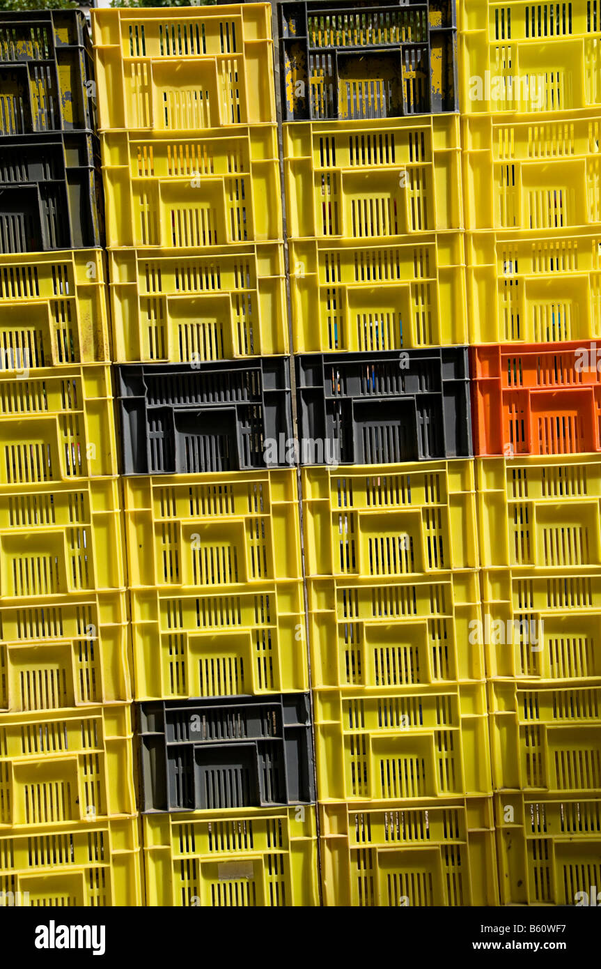 plastic crates stacked with produce at market in carcassonne Stock