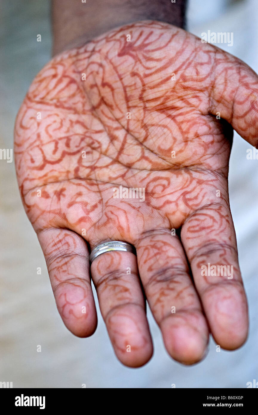 mehndi on a mans hand ready for his wedding Stock Photo