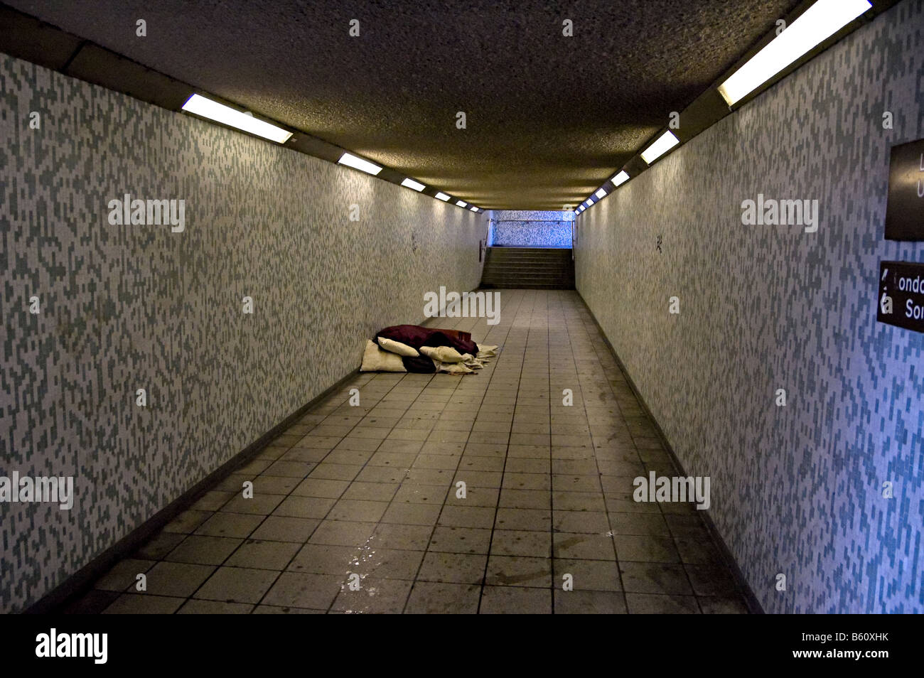 a rough homeless sleeper in london in an underpass Stock Photo