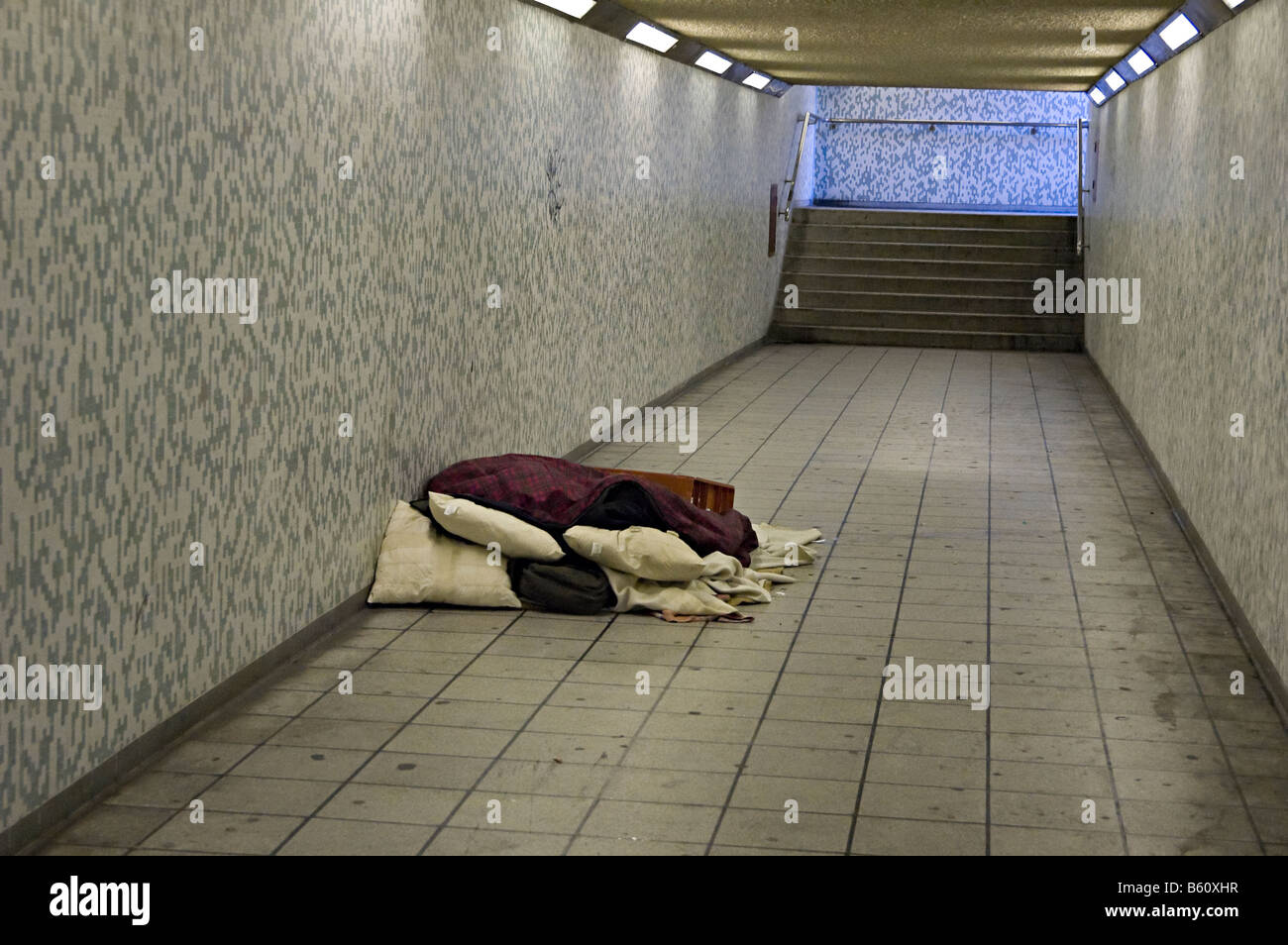 a rough homeless sleeper in london in an underpass Stock Photo
