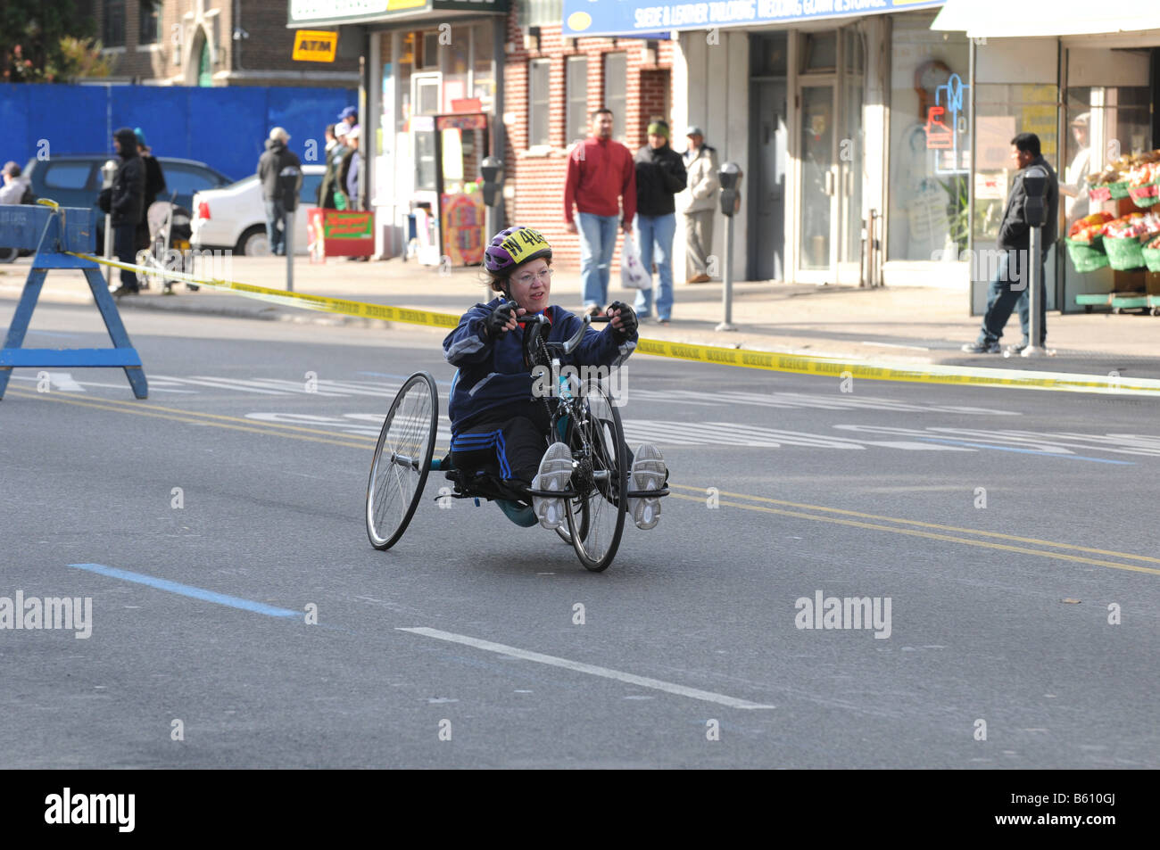 handicapped competitor on three wheel tricycle racing in nyc marathon 2008 Stock Photo