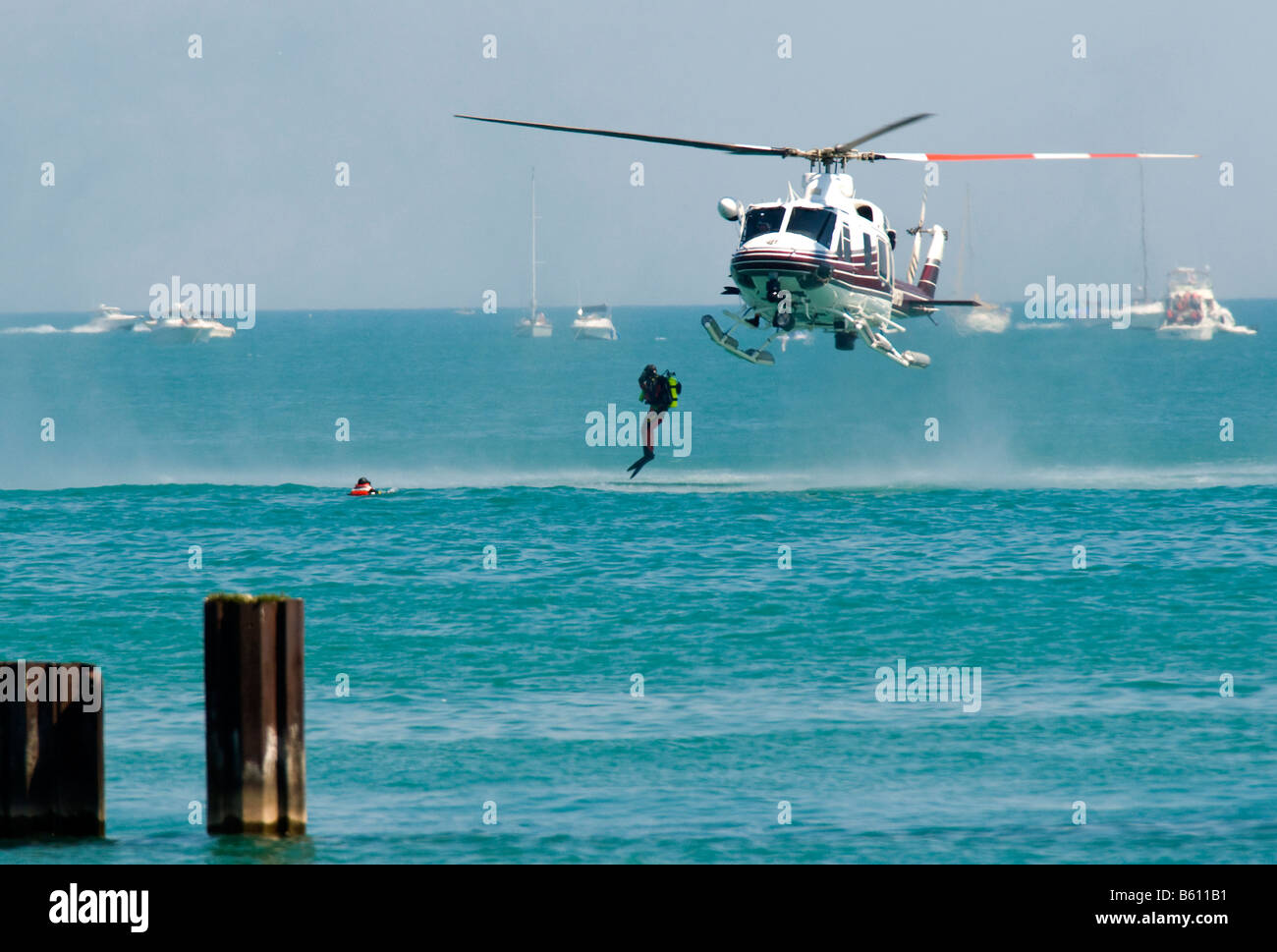 Rescue swimmer jumping from helicopter Bell 205/Huey Chicago Fire