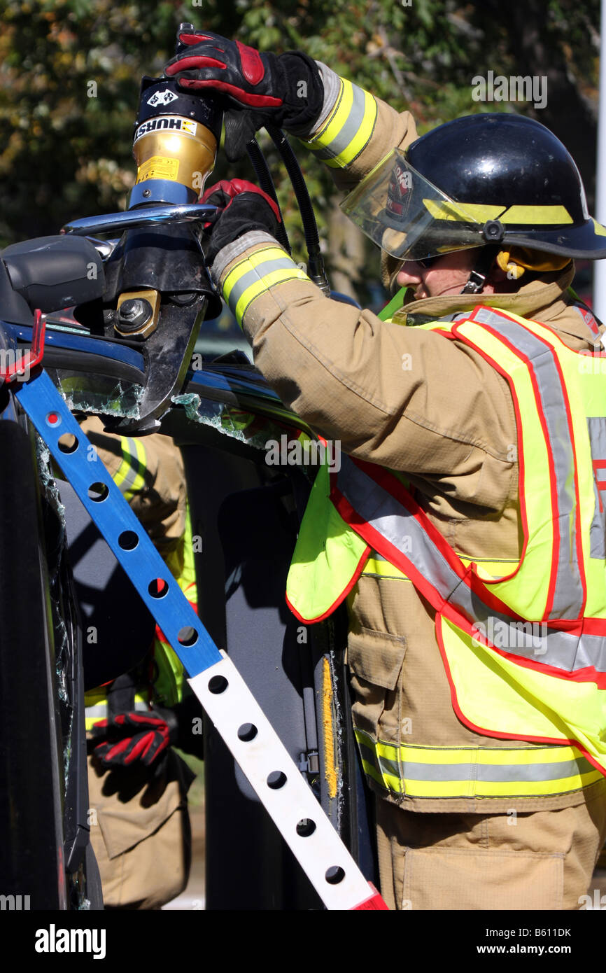 firefighter has used the jaws of life extrication tool to cut through a