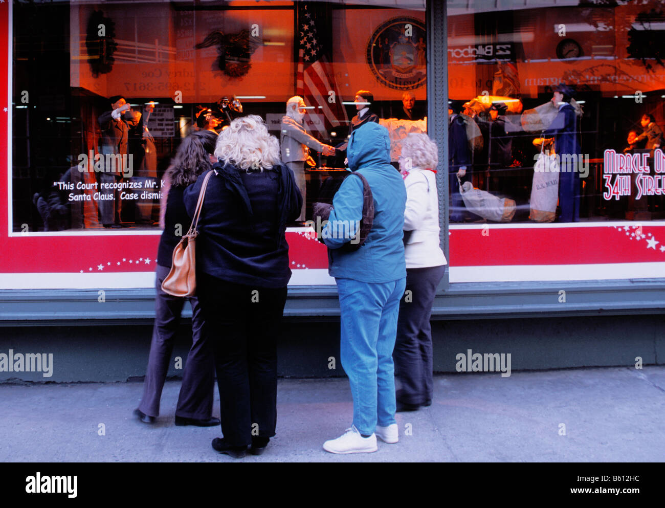 USA New York City Macy's department store Christmas shoppers window shopping. Stock Photo