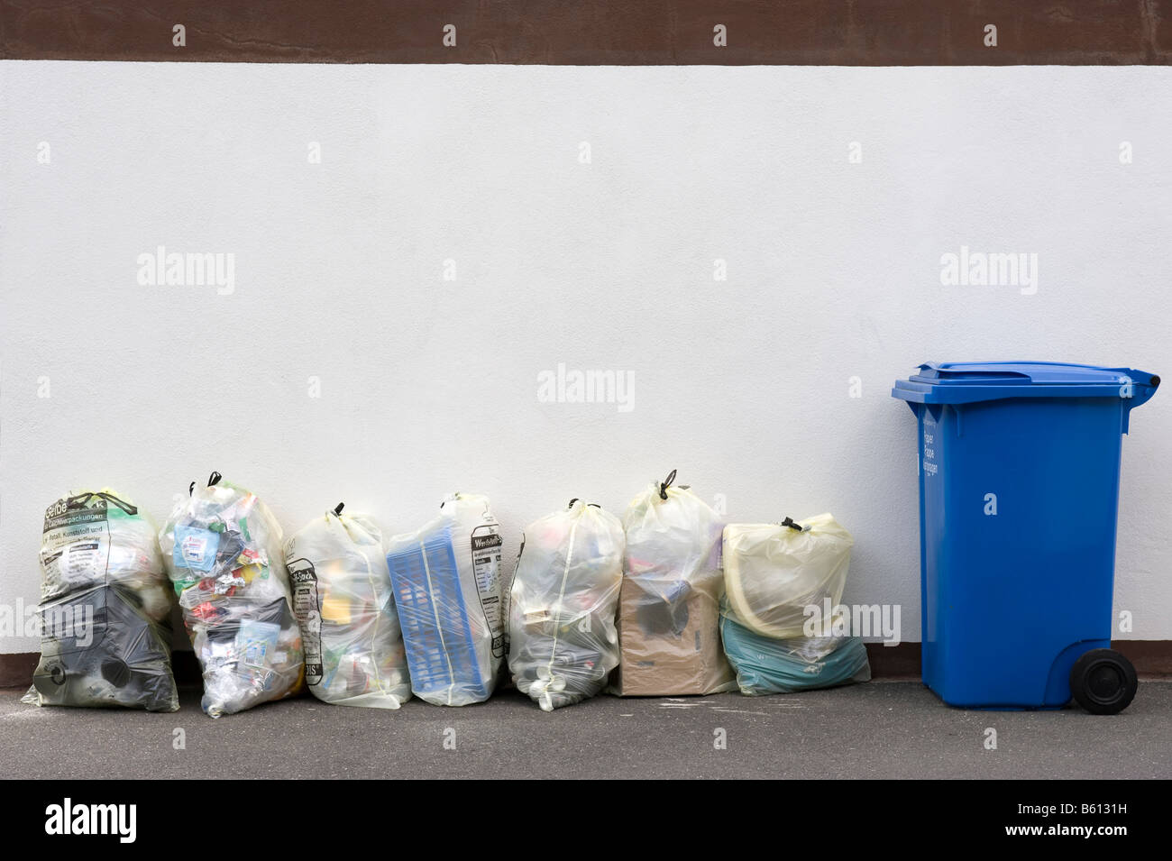 Yellow bags full of plastic waste Stock Photo - Alamy