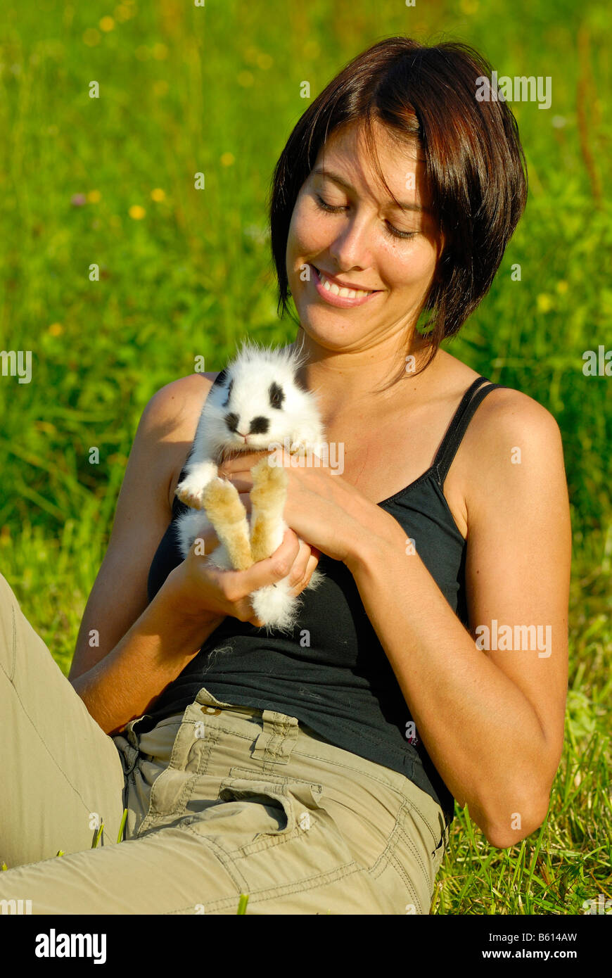 Young woman holding a Pygmy Rabbit (Brachylagus idahoensis) Stock Photo
