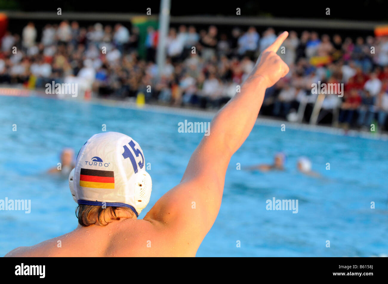 Water polo players being cheered on by Tobias Preuss, Germany, to the eminent victory, National Championships, Germany versus Stock Photo
