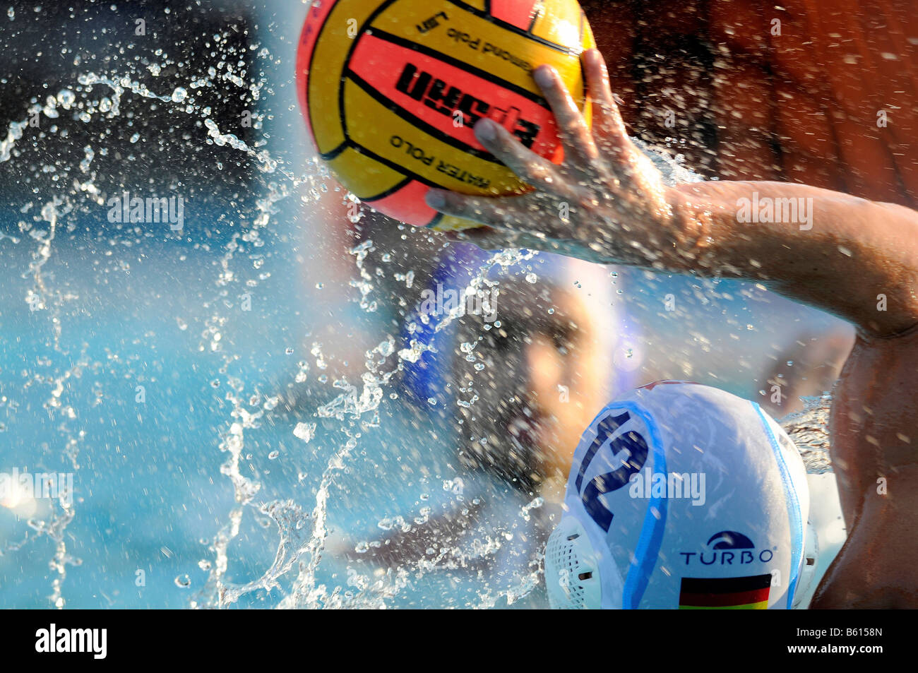 Water polo player, Soeren Mackeben about to throw the ball, National Championships, Germany versus Croatia in the outdoor pool Stock Photo