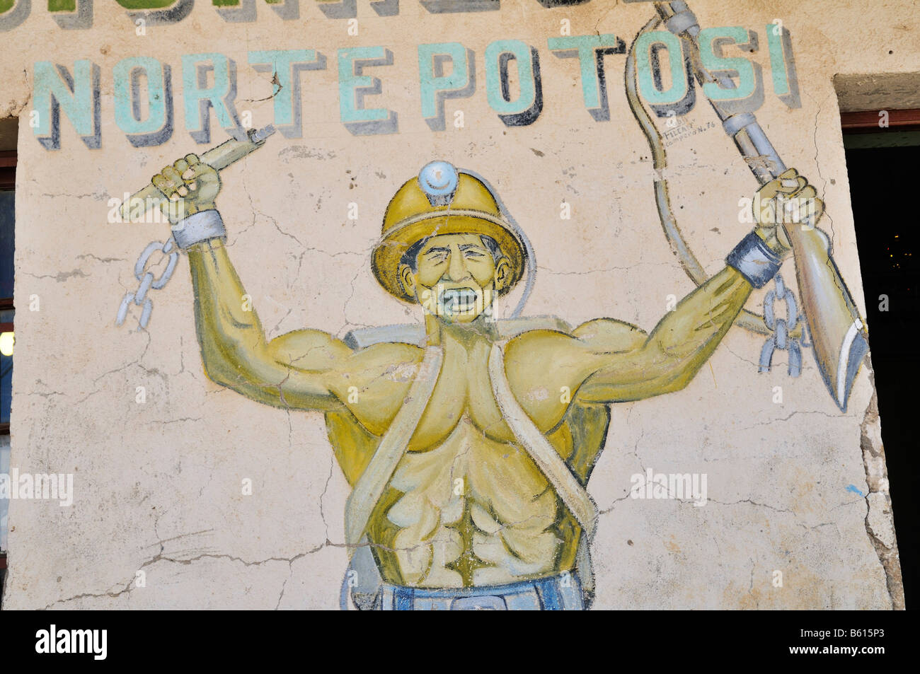 Picture of a combative miner holding dynamite and a gun on, a house wall, Llallagua mining centre, Potosi, Bolivia Stock Photo