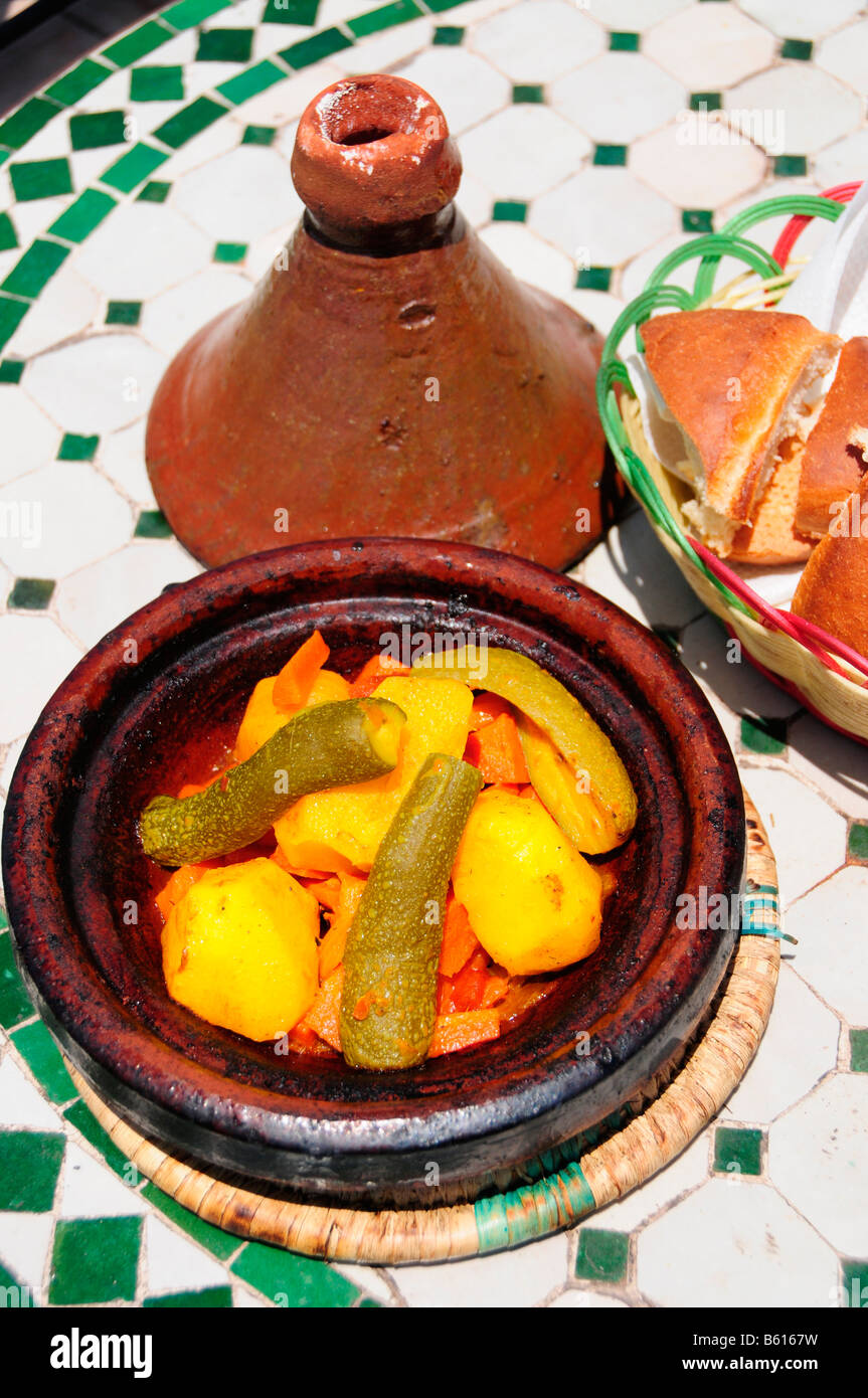 Tajine, Moroccan speciality, in a typical pot in a restaurant on Djemma el-Fna Square, 'Imposter's Square' or 'Square of the Stock Photo