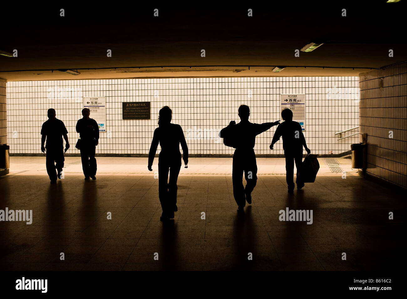 Tourists use an underpass to walk under a busy city street near Tiananmen Square in Beijing China in April 2008 Stock Photo