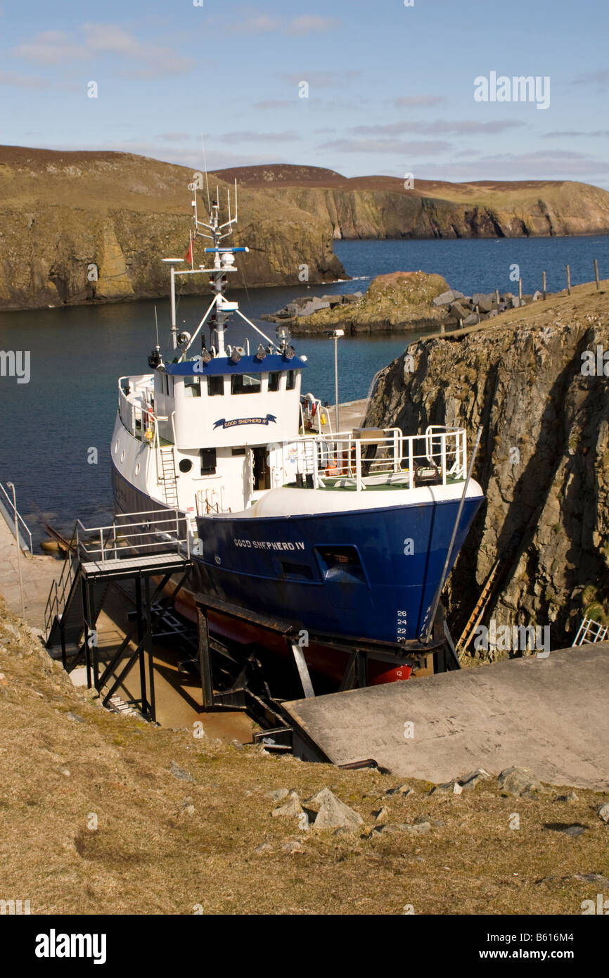 Good Shepherd IV moored in special dock on Fair Isle Shetland Stock