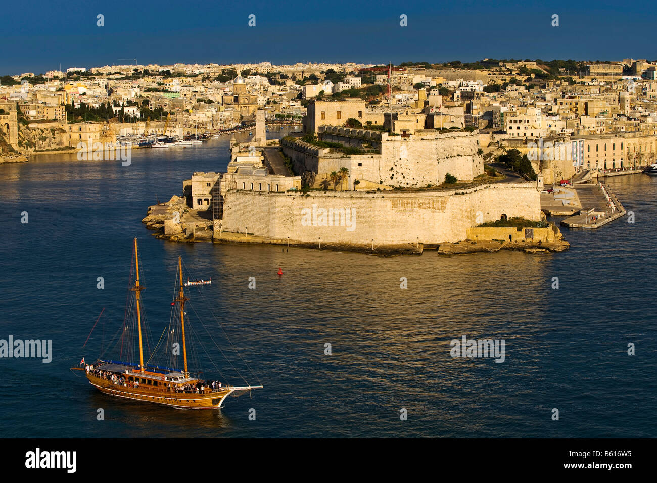 Fort San Angelo, Vittoriosa, The Three Cities from La Valletta with Grand Harbour and a twin-masted sailing ship, Malta, Europe Stock Photo