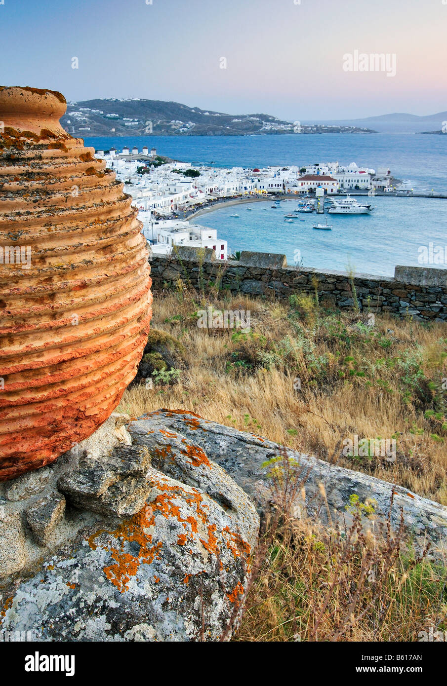 Antique clay vase in front of the old port of Mykonos, Cyclades, Greece, Europe Stock Photo