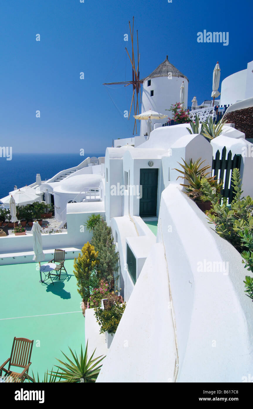 Typical Cycladic architecture and a windmill, Oia, Ia, Santorini, Cyclades, Greece, Europe Stock Photo