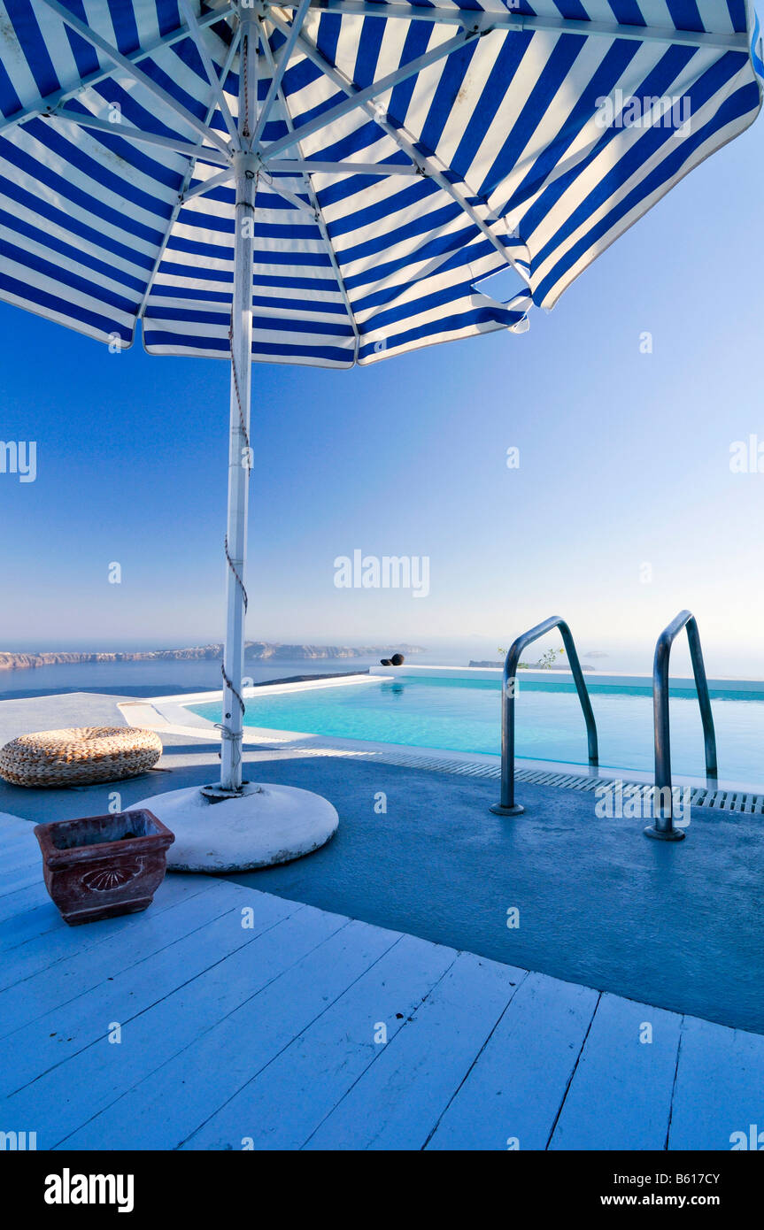 pool sun shade on Terrace With A Swimming Pool And A Sunshade In Front Of The Blue Sea Stock Photo Alamy