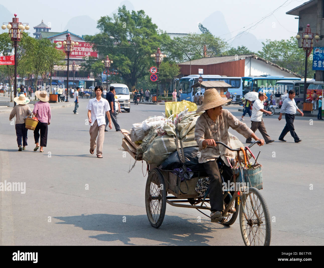 Man Peddles Loaded Tricycle in Yangshuo Guangxi China Stock Photo Alamy