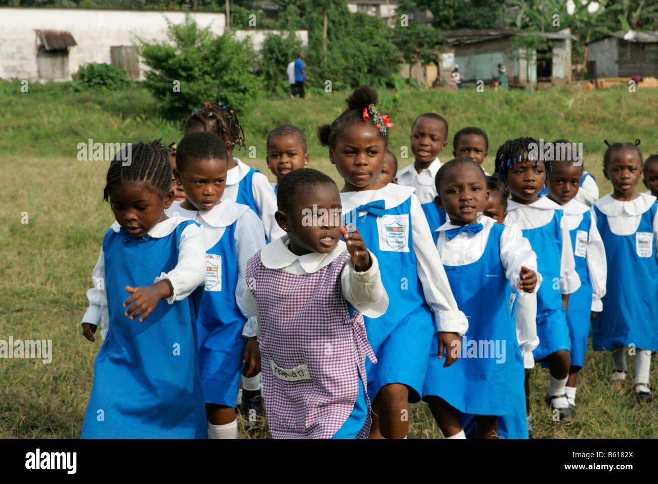 Pre-school children wearing uniforms during morning exercise, Buea, Cameroon, Africa Stock Photo