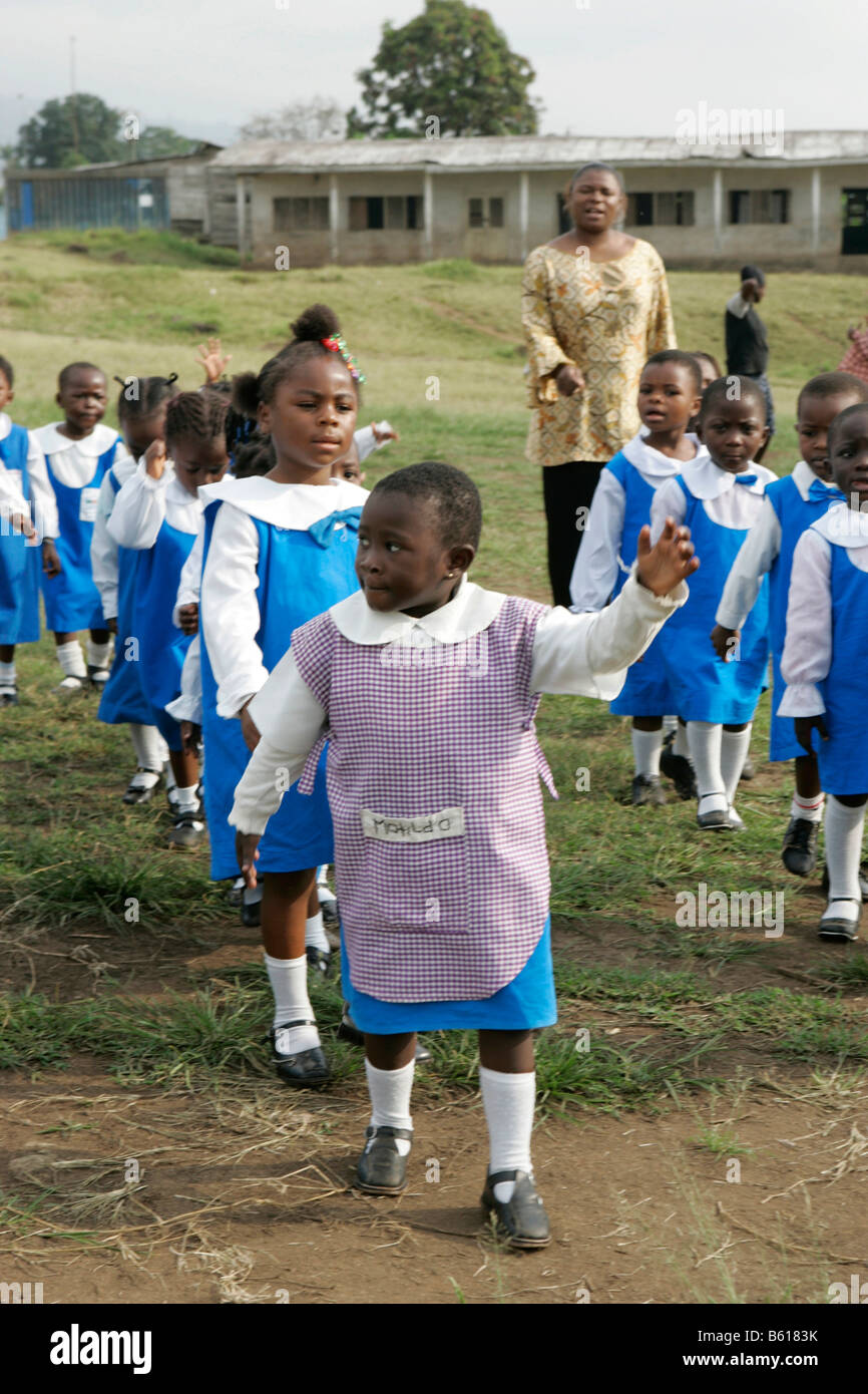 Pre-school children wearing uniforms during morning exercise, Buea, Cameroon, Africa Stock Photo