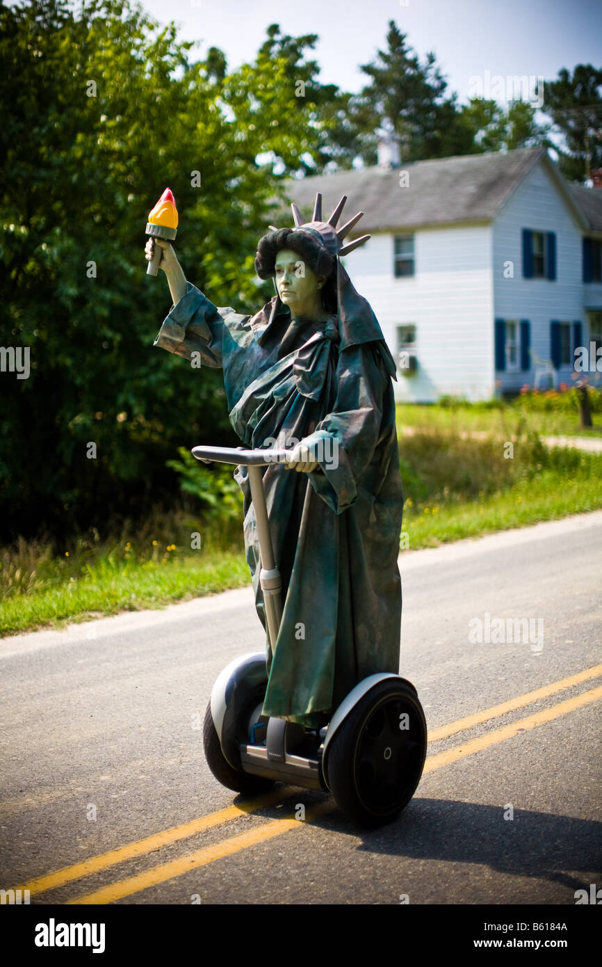 Woman dressed as Statue of Liberty on a Segway during the 4th of July parade through Irvington, VA on Wednesday, July 4, 2007. Stock Photo