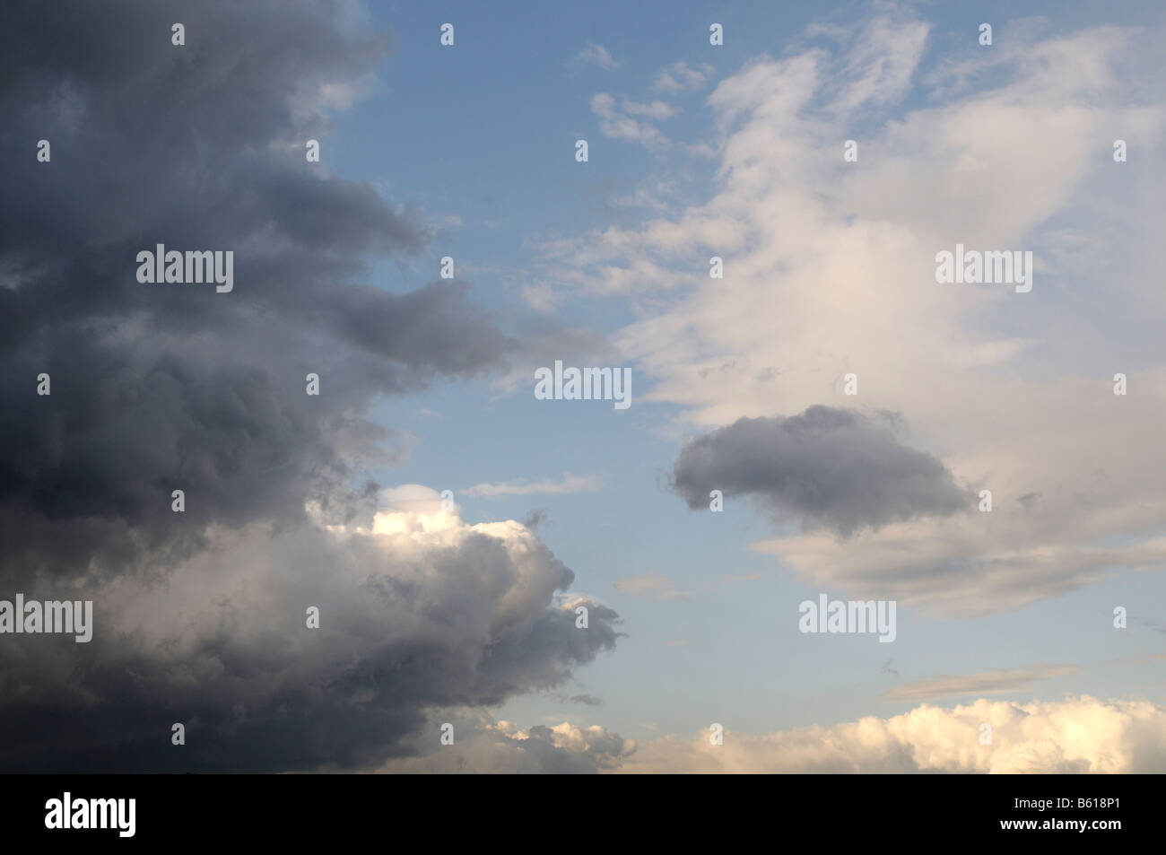 Dark rain clouds covering a bright sky Stock Photo