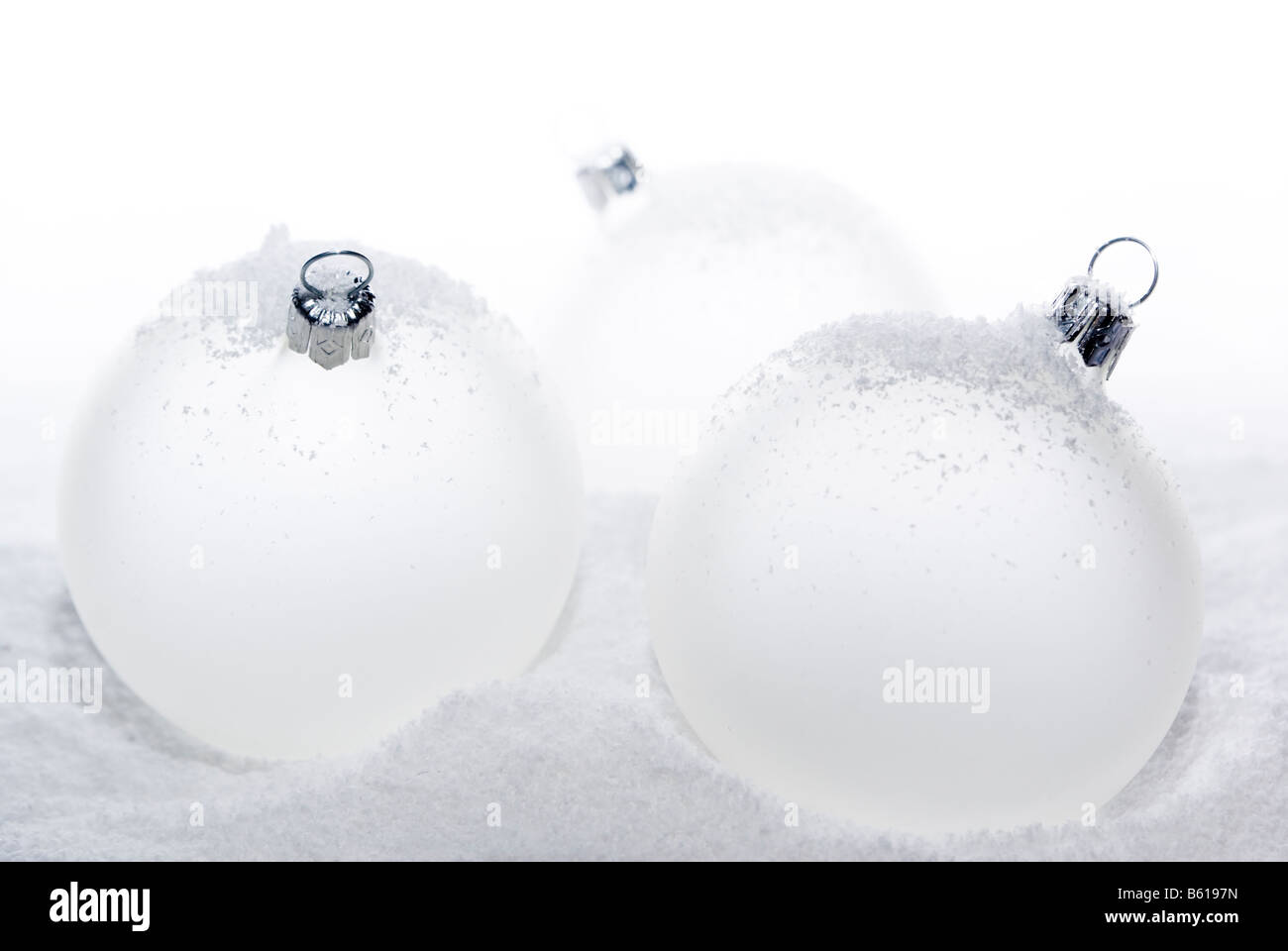 Christmas balls lying on the snow. aRGB. Stock Photo