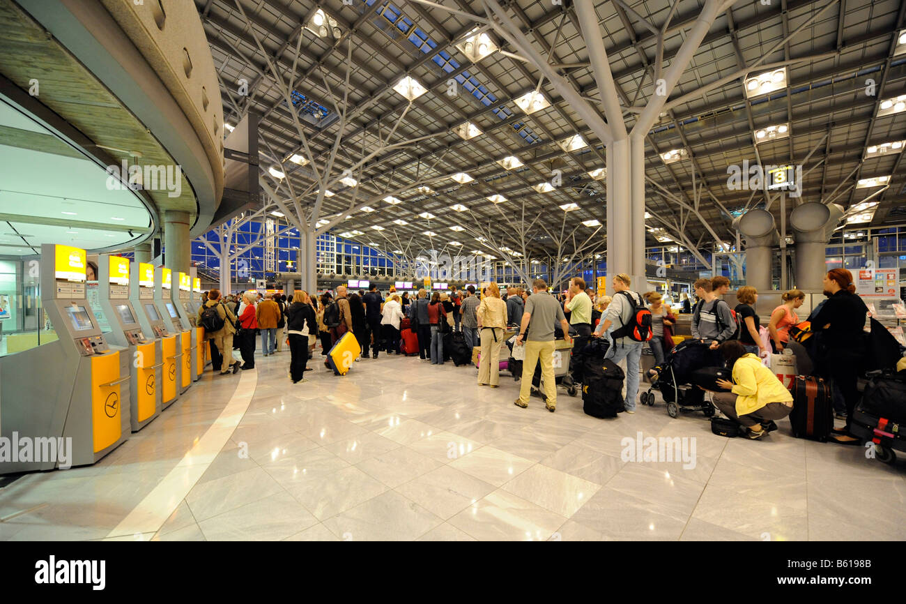 Passengers waiting in queues at check-in counters, Stuttgart Airport, Baden-Wuerttemberg Stock Photo