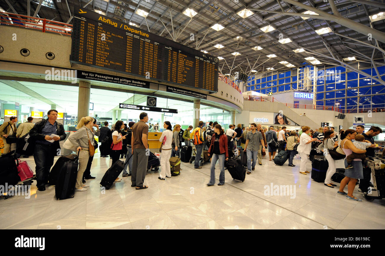 Passengers waiting in queues at check-in counters, Stuttgart Airport, Baden-Wuerttemberg Stock Photo